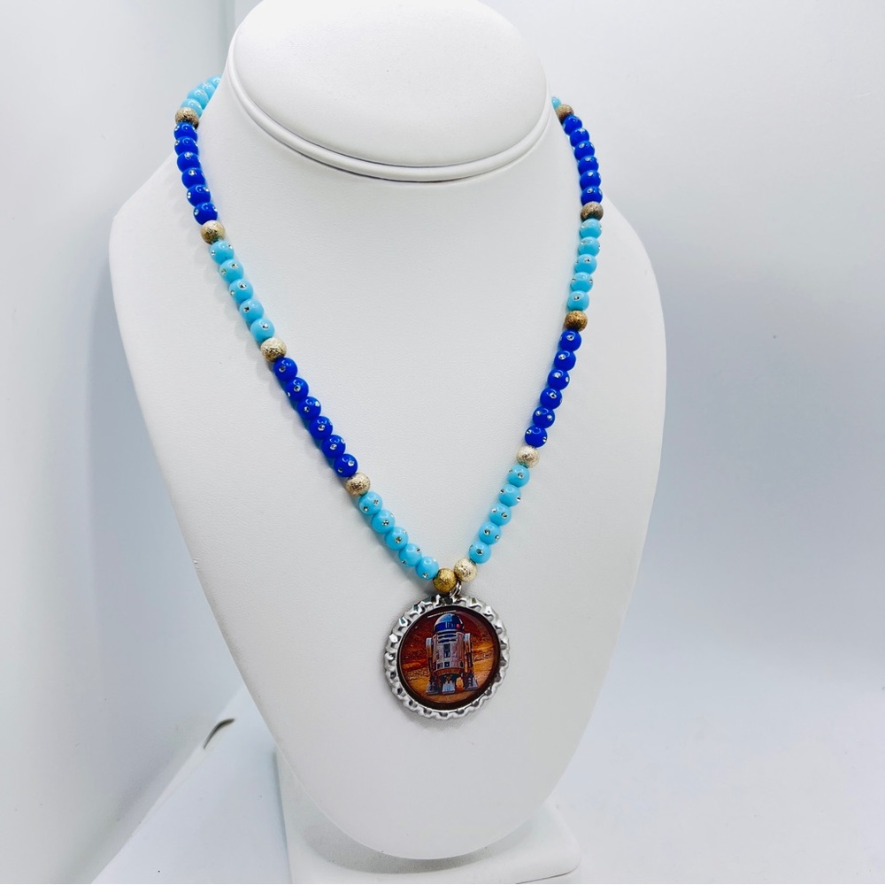 Star Wars R2-D2 pendant necklace with a bottle cap design.